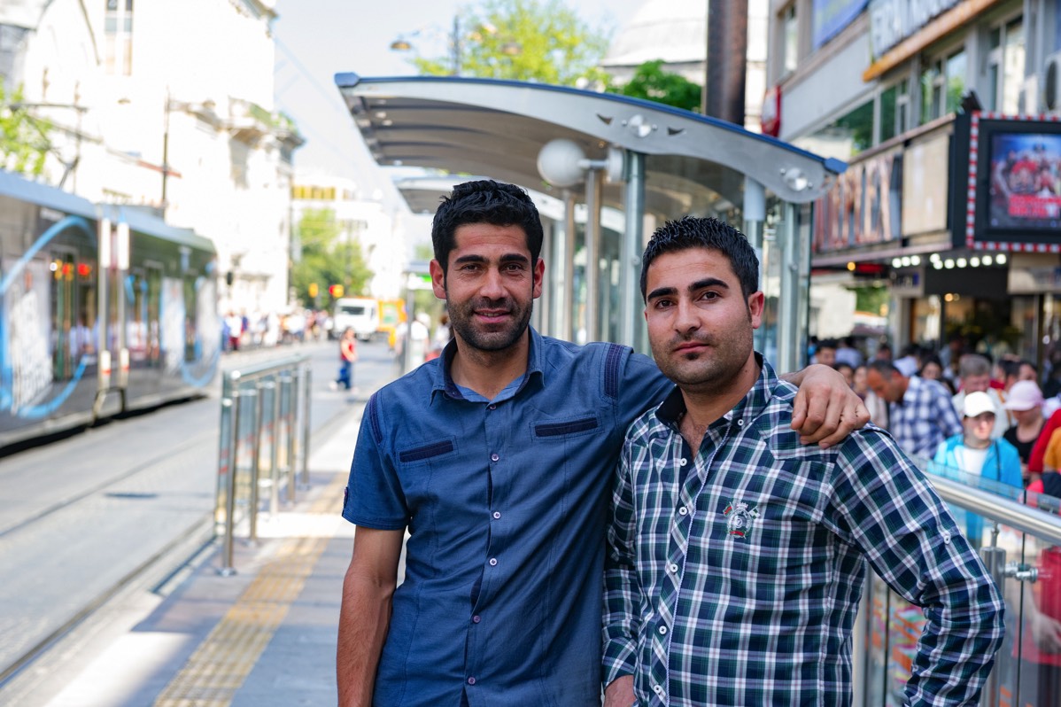 Friends at a tram stop in Istanbul